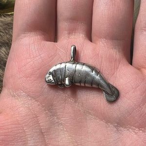 Adorable vintage sterling silver manatee pendant